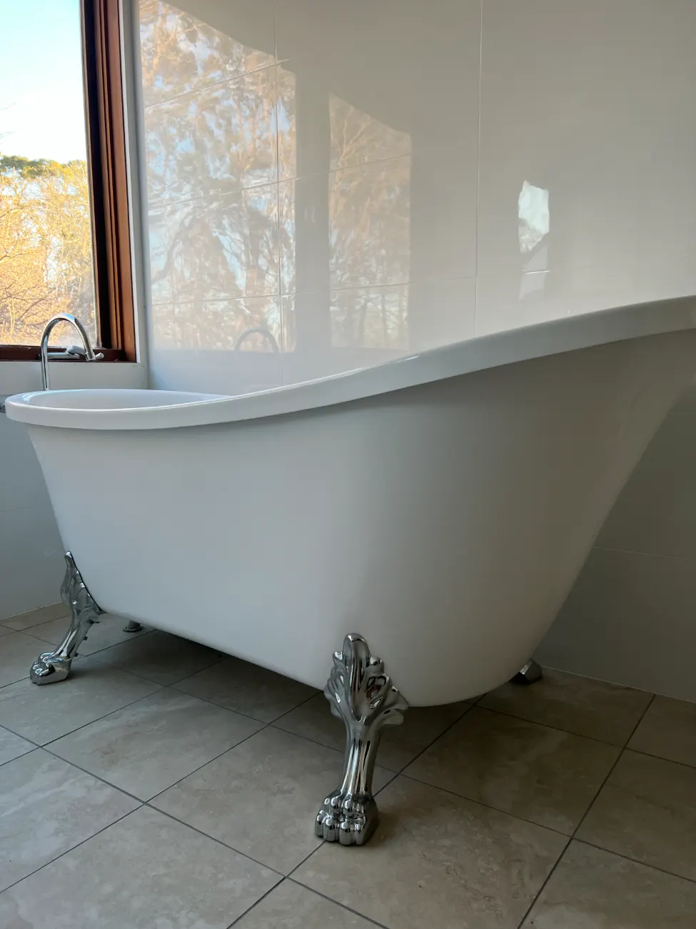 Clawfoot bath in a bright country bathroom