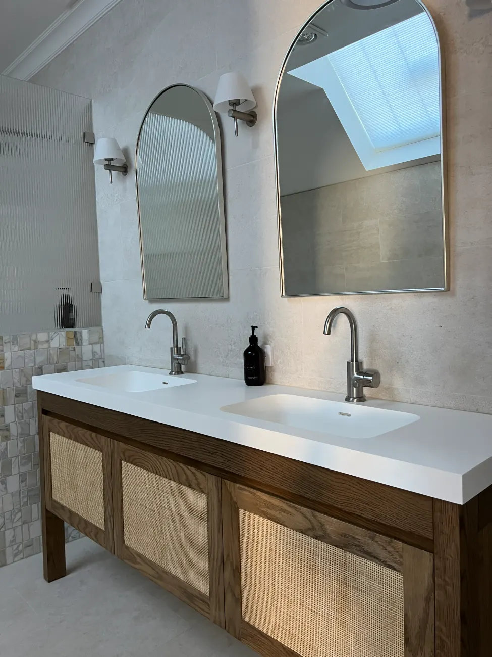 Renovated home bathroom with a rattan double vanity